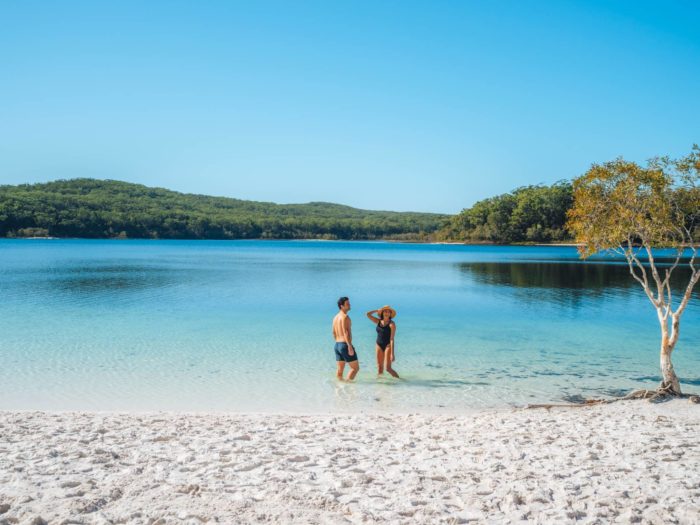 Couple relaxing in the water at Lake McKenzie